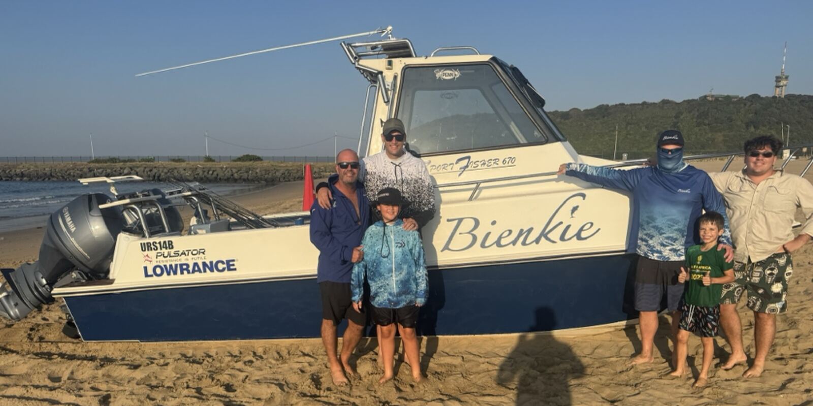 The Bienkie crew on the beach beside the boat